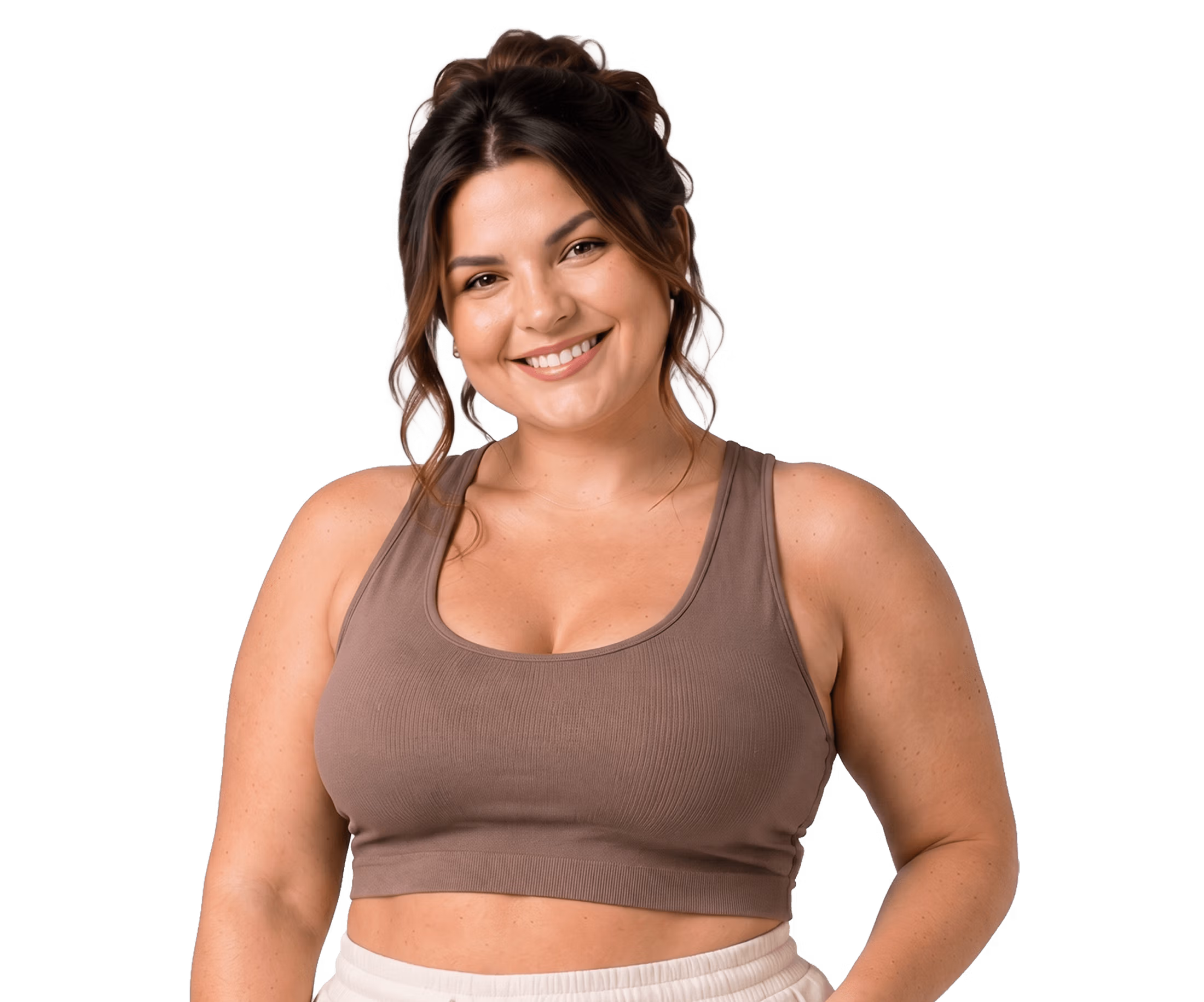 A smiling woman wearing a taupe athletic top