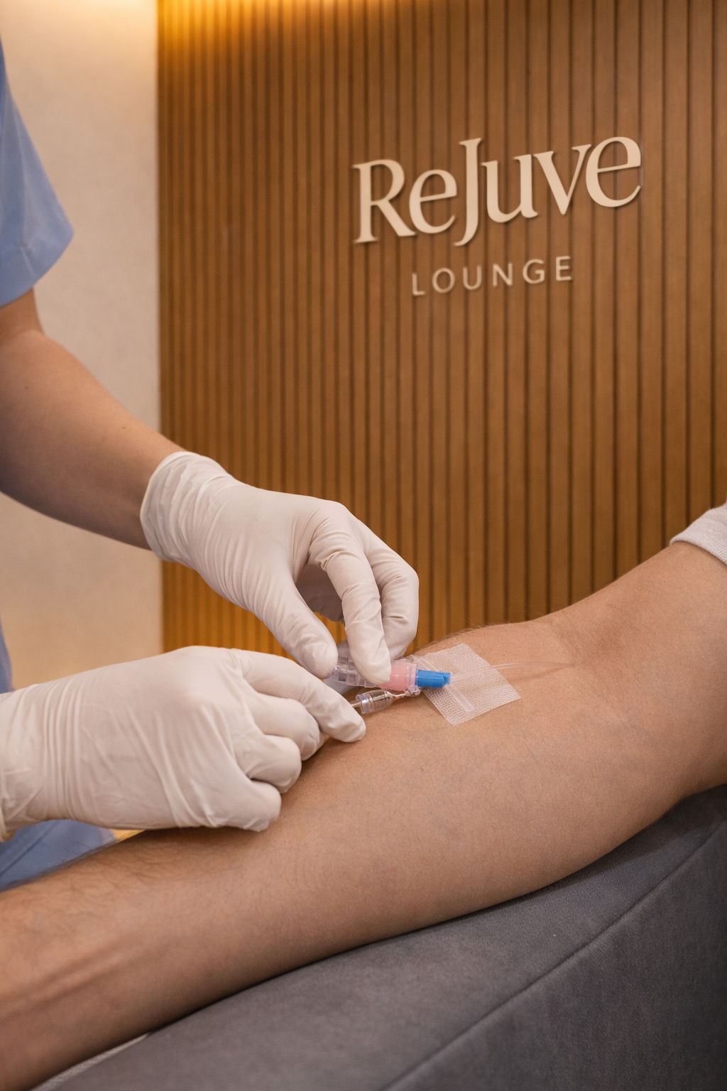 Nurse administering IV therapy at ReJuve Lounge